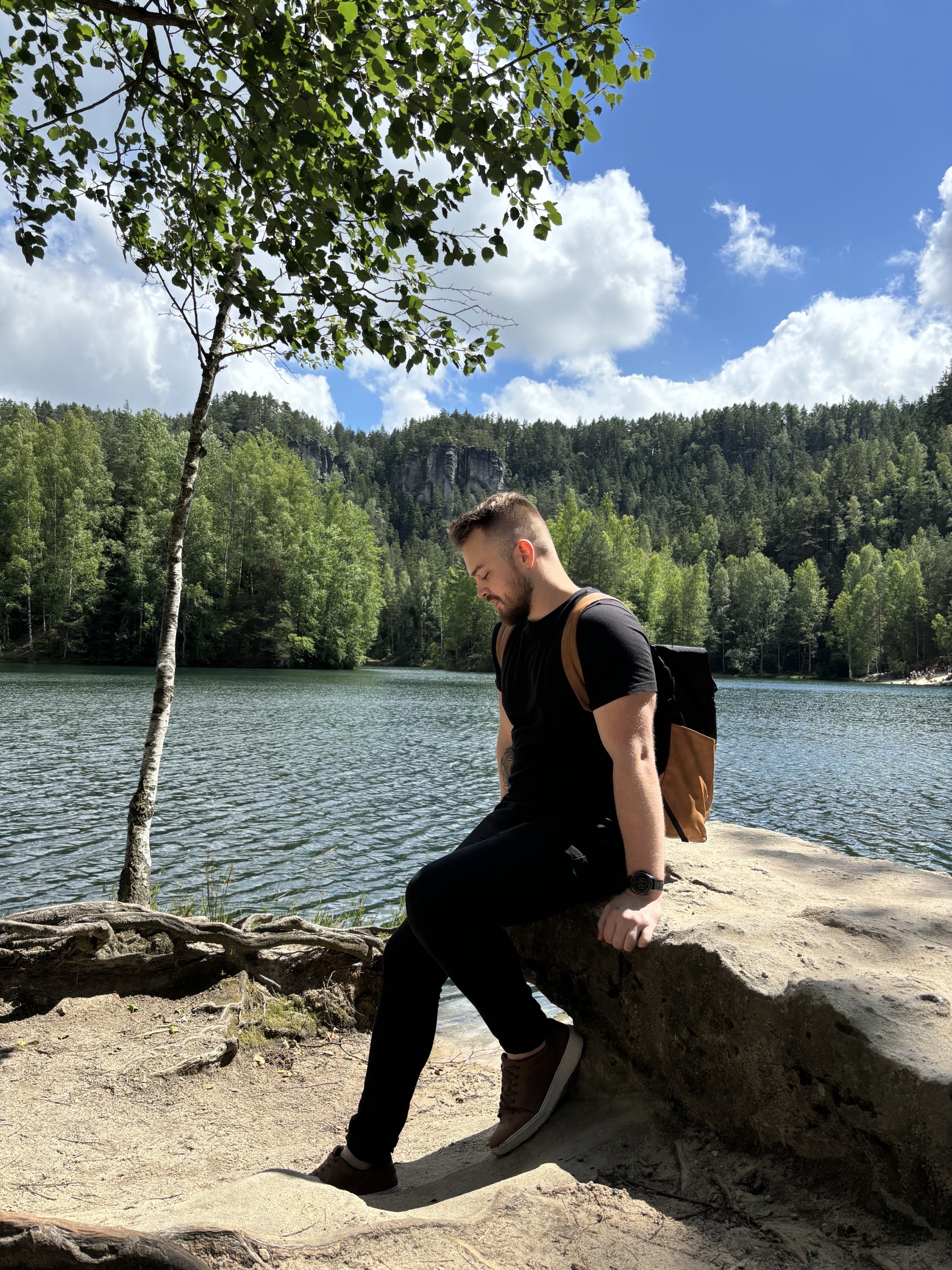 Piotr Zagóra beside a forest lake